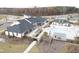 Aerial view of community pool, clubhouse, and tennis courts at 1008 Tuscarora Ln, Durham, NC 27703