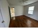 Hardwood floor bedroom with view of kitchen at 1011 Bellvue St, Burlington, NC 27217