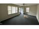 Bright living room with large windows and ceiling fan at 1011 Bellvue St, Burlington, NC 27217