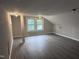 Spacious bonus room with two windows and hardwood floors at 1015 Cross Link Rd, Raleigh, NC 27610