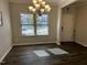 Dining room with hardwood floors and large windows at 107 Explorer Dr, Morrisville, NC 27560