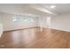 Finished basement with laminate flooring and ample natural light at 108 N Woodshed Ct, Cary, NC 27513