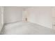 Well-lit bedroom with grey carpet and access to another room at 108 N Woodshed Ct, Cary, NC 27513