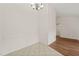 Light and airy dining area with tile flooring and chandelier at 108 N Woodshed Ct, Cary, NC 27513