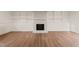 Spacious Gathering room featuring a fireplace and built-in shelving at 108 N Woodshed Ct, Cary, NC 27513