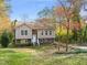 Two-story house with brick and siding exterior, steps and landscaping at 108 N Woodshed Ct, Cary, NC 27513