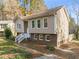 Two-story house with brick and siding exterior, steps, and driveway at 108 N Woodshed Ct, Cary, NC 27513