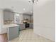 Open concept kitchen with gray cabinets and island at 108 N Woodshed Ct, Cary, NC 27513