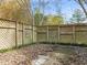 Small patio area enclosed by a wooden lattice fence at 108 N Woodshed Ct, Cary, NC 27513