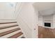 Staircase with wooden steps and white railings leading to the Gathering room at 108 N Woodshed Ct, Cary, NC 27513