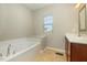 Bathroom with a garden tub and double vanity at 113 Durants Neck Ln, Morrisville, NC 27560