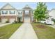 Two-story townhome with attached garage and manicured lawn at 113 Durants Neck Ln, Morrisville, NC 27560