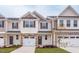 Two-story townhome with attached garage and landscaping at 133 Fairwinds Dr, Lillington, NC 27546