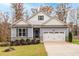 Two-story house with gray siding, white trim, and a two-car garage at 146 Clear Water Rd, Louisburg, NC 27549