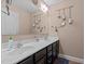 Double vanity bathroom with dark brown cabinets and a large mirror at 146 Trenton Pl, Cameron, NC 28326