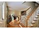 Wooden staircase with carpet treads and railing leading to upper level at 1524 Wedgewood Dr, Graham, NC 27253