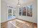 Bright breakfast room with hardwood floors and access to backyard deck at 174 Craig Hill Ln, Chapel Hill, NC 27516