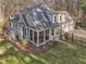 House exterior with deck, screened porch, and three-car garage at 174 Craig Hill Ln, Chapel Hill, NC 27516