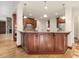 Large kitchen island with granite countertop and wood cabinetry at 174 Craig Hill Ln, Chapel Hill, NC 27516