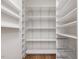 Walk-in pantry with ample shelving for storage at 174 Craig Hill Ln, Chapel Hill, NC 27516