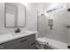 Bathroom with gray vanity, marble countertop, and glass shower at 184 Dereham Ln, Garner, NC 27529