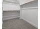 Large walk-in closet with double hanging rods and shelves at 184 Dereham Ln, Garner, NC 27529