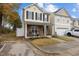 Two-story townhome with stone accents and front porch at 1925 Serenade Cir, Raleigh, NC 27610