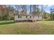 Single-story home with a green exterior and landscaping at 1970 Old Us Hwy 64, Spring Hope, NC 27882