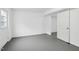 Unfinished basement with grey flooring, white walls and separate rooms at 2112 Eastwood Dr, Durham, NC 27703