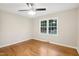 Spacious bedroom with hardwood floors, ceiling fan and a window offering natural light at 2112 Eastwood Dr, Durham, NC 27703