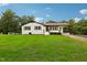 Charming ranch home with a spacious lawn and driveway at 2112 Eastwood Dr, Durham, NC 27703