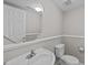 Powder room with a pedestal sink and toilet at 2659 Garden Knoll Ln, Raleigh, NC 27614