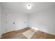 Bright bedroom with hardwood floors and double doors at 2703 Augusta Dr, Durham, NC 27707