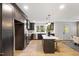 Renovated kitchen, featuring dark cabinetry, marble countertops, and stainless steel appliances at 2703 Augusta Dr, Durham, NC 27707