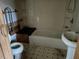 Second bathroom with shower/tub combo and a sink at 3010 University Dr, Durham, NC 27707