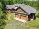 Aerial view of house with two car garage at 3240 Hillcastle Trl, Chapel Hill, NC 27516