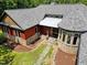 Aerial view of house with stone accents and landscaping at 3240 Hillcastle Trl, Chapel Hill, NC 27516