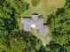 Aerial view of house nestled in the woods at 3240 Hillcastle Trl, Chapel Hill, NC 27516