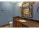 Bathroom with granite vanity, mosaic mirror, and tiled shower at 3240 Hillcastle Trl, Chapel Hill, NC 27516