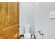 Simple, clean bathroom with a toilet and wood door at 3240 Hillcastle Trl, Chapel Hill, NC 27516