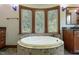 Luxurious bathroom with soaking tub, granite vanity, and walk-in shower at 3240 Hillcastle Trl, Chapel Hill, NC 27516