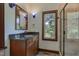 Bathroom with granite countertop vanity, window, and glass shower at 3240 Hillcastle Trl, Chapel Hill, NC 27516