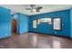 Blue bedroom with hardwood floors and ceiling fan at 3240 Hillcastle Trl, Chapel Hill, NC 27516