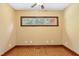 Bright bedroom with hardwood floors and a large window at 3240 Hillcastle Trl, Chapel Hill, NC 27516