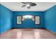 Blue bedroom with hardwood floors and ceiling fan at 3240 Hillcastle Trl, Chapel Hill, NC 27516