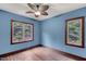 Bedroom with hardwood floors and multiple windows at 3240 Hillcastle Trl, Chapel Hill, NC 27516