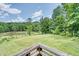 Elevated deck offering scenic pond views at 3240 Hillcastle Trl, Chapel Hill, NC 27516