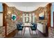 Modern dining room with stone wall and stylish furnishings at 3240 Hillcastle Trl, Chapel Hill, NC 27516