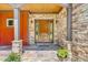 Elegant house entrance with stone accents and a wooden door at 3240 Hillcastle Trl, Chapel Hill, NC 27516