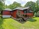 Red house with deck and stairs at 3240 Hillcastle Trl, Chapel Hill, NC 27516